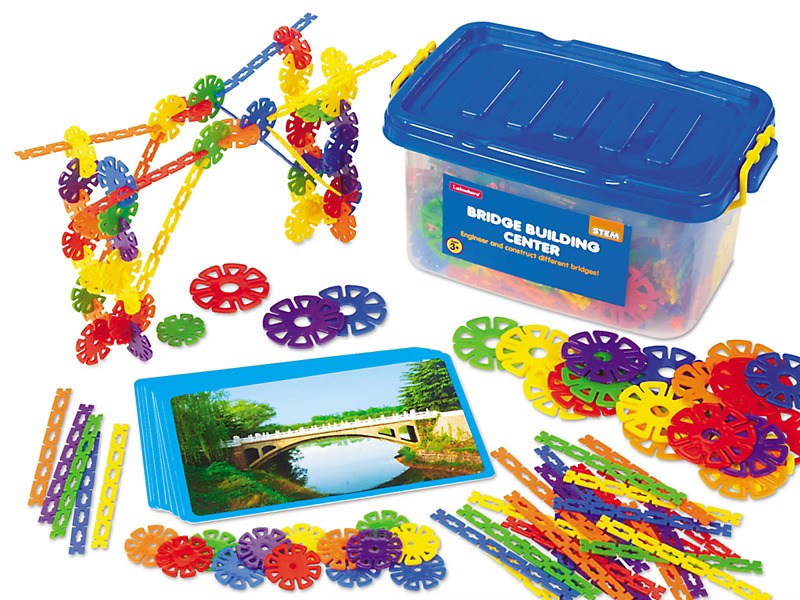 STEM bridge building kit with colorful plastic connectors and a box labeled "Bridge Building Center."