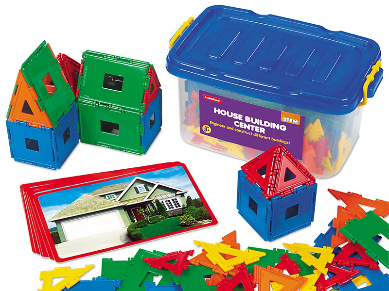 STEM building kit with colorful interlocking pieces, a storage container, and house model examples.