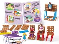 A construction toy set themed around "Goldilocks and the Three Bears." It includes illustrated story pages, building pieces, bear figures, and constructed chairs.