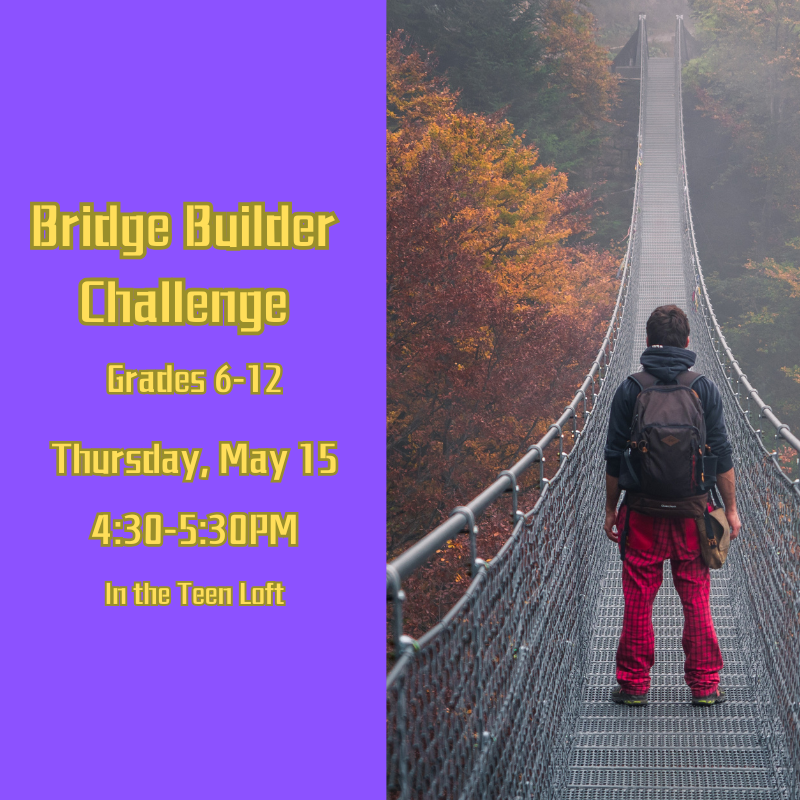 A man standing on a bridge.